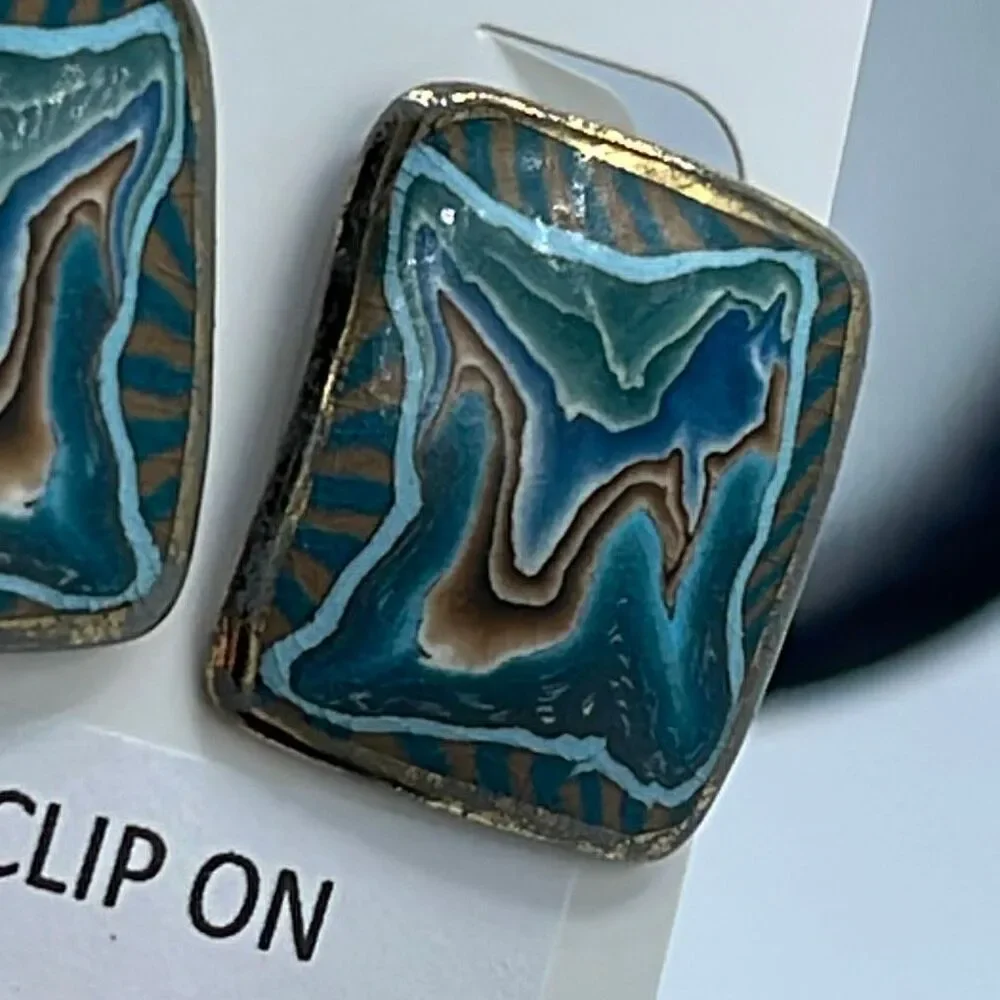 Vintage metal enamel clip style earrings.